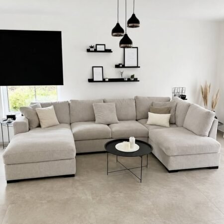 Modern U shape sofa with spacious seating, soft upholstery, and elegant contemporary living room décor.