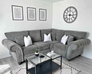 Ashwin 4-seater sofa featuring a contemporary design, soft upholstered cushions, wide armrests, and spacious seating ideal for modern living rooms.