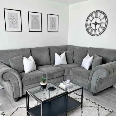 Ashwin 4-seater sofa featuring a contemporary design, soft upholstered cushions, wide armrests, and spacious seating ideal for modern living rooms.