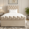 Chesterfield bed with tufted upholstered headboard and luxury fabric finish