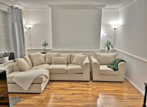 Modern upholstered sofa with comfortable seating, elegant cushions, and contemporary living room design.